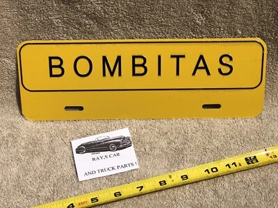 NEW BOMBITAS UNIVERSAL LICENSE PLATE TOPPER . - Image 1 of 4