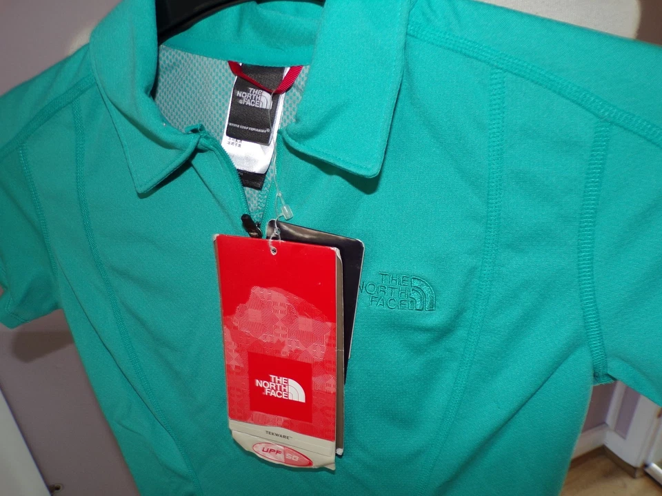 NUEVO CON ETIQUETAS DAMAS DISEÑADOR THE NORTH FACE HYDRY POLO CICLISMO CAMISA PRECIO DE VENTA SUGERIDO POR EL FABRICANTE £50 UK XS (6/8) Foto 1 de 1