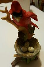 Beautiful Cardinal watching over his nest figurine Price Products Label