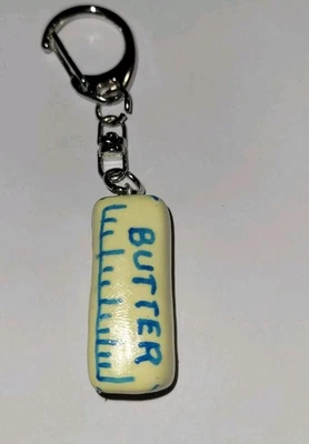 Llavero de mantequilla plateado clip en accesorio registro lácteo Foto 1 de 3