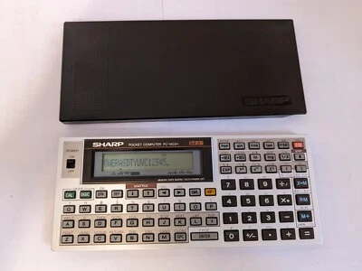 sharp 1403h s'allume pocket computer - Photo 1/4