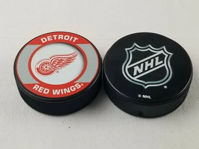 Detroit Red Wings & NHL brand Team Logo Retro Souvenir Hockey Pucks lot of 2 - Image 1 of 3