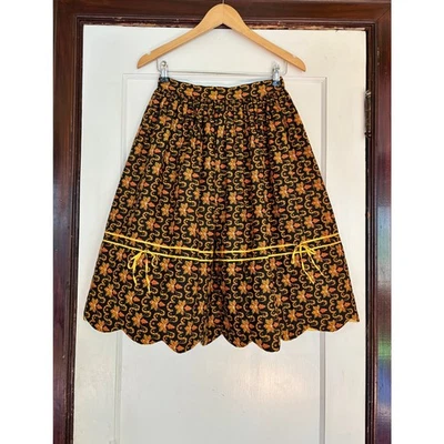 Falda acolchada negra y naranja vintage hecha a mano con estampado festoneado - talla pequeña Foto 1 de 4