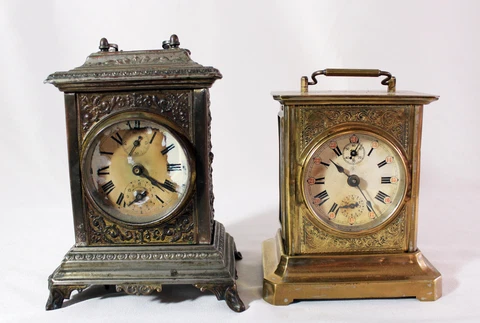 two antique wind up alarm clocks one Junghans, one with musical alarm. Repair !! Cover