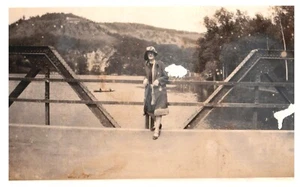 LADY ON BRIDGE WITH KAYAK IN BACKGROUND,WISCONSIN DELLS,1920'S.4.3" x 2.5" PHOTO - Picture 1 of 2