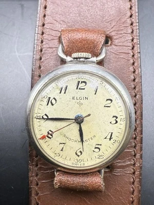 RELOJ BOLSILLO ANTIGUO ELGIN SHOCKMASTER 629 CONVERSIÓN TRINCHERA CAJA ESTERLINA FUNCIONA Foto 1 de 4
