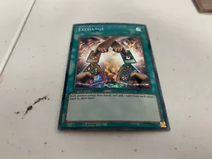 EXCHANGE SECRET RARE SBC1-ENI16 NEAR MINT YUGIOH 1st E - Picture 1 of 2