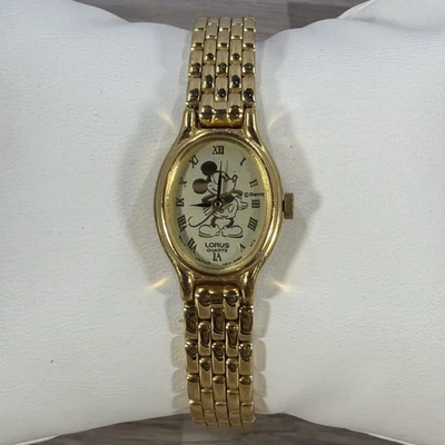 "Reloj de vestir Lorus para mujer V810-6610 Mickey Mouse tono dorado ovalado cuarzo 17 mm 7""" Foto 1 de 4