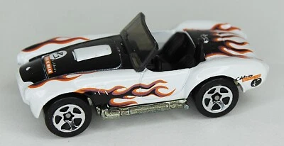 Vintage Hot Wheels Reels SHELBY COBRA 1:64 Celebrity Hollywood Tours White - image 1 of 4