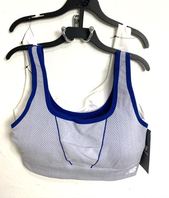 Sujetador deportivo New Balance talla L paquete de 2 pulóveres acolchados blancos azules elásticos Foto 1 de 4