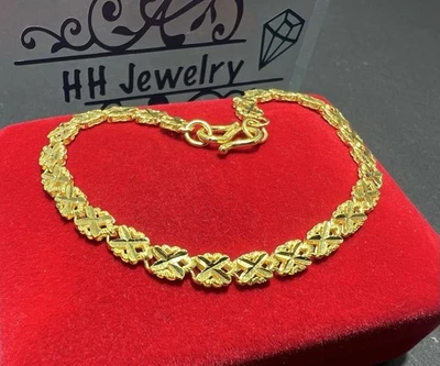 Brazalete de oro amarillo de 24 quilates con diseño de corte de diamante mezcla de flores Foto 1 de 4