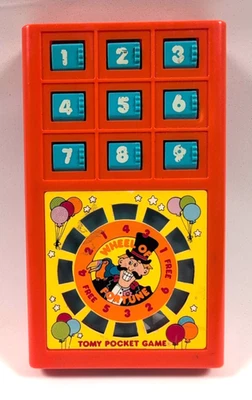 Tomy Pocket Game Wheel of Fortune portátil probado funciona - juguete de colección coleccionable Foto 1 de 4