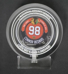 CONNOR BEDARD CHICAGO BLACKHAWKS NHL DEBUT CRYSTAL PUCK GAME USED ICE DISPLAY - Picture 1 of 8