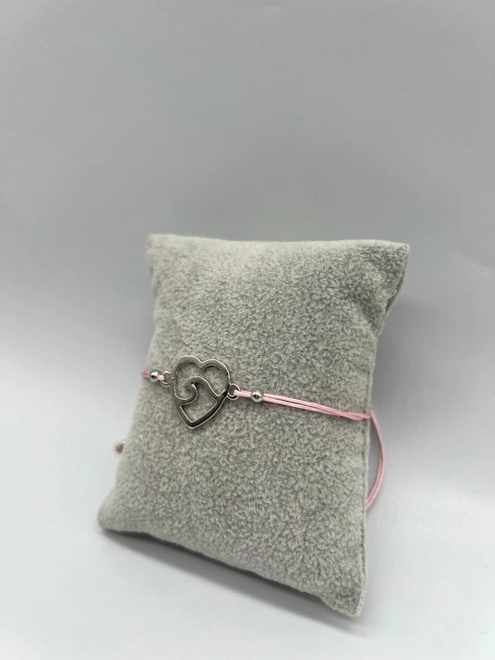Pulsera ajustable enchapada en plata con cuerda rosa amuleto onda en corazón paquete de 12 Foto 1 de 4