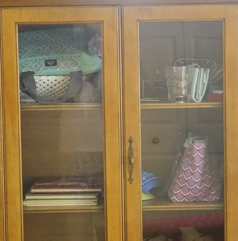 Buffet solid darkish wood. Very heavy Glass and wood doors, carved Cover