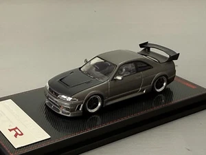 MODELLO ACCENSIONE 1:64 NISSAN SKYLINE GT-R R33 NISMO GRIGIO TITANIO 2507 - Foto 1 di 3