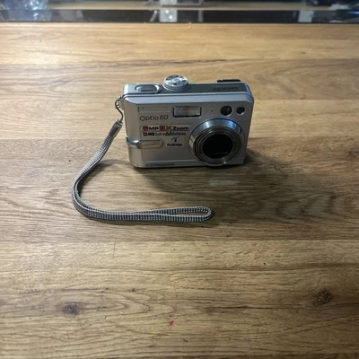 Pentax Optio 60 Digitalkamera 6.0MP mit Zubehörpaket: Anleitung / SD 256MB - Bild 1 von 4