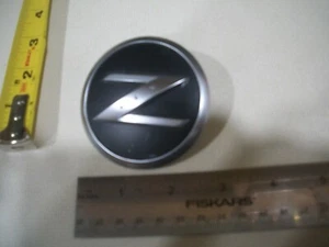 NISSAN ROUND BLACK Z SYMBOL EMBLEM OEM CHROME USED - Bild 1 von 1