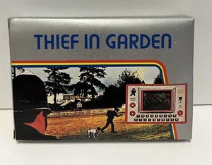 CONSOLE THIEF IN THE GARDEN TG-18 GAME LCD HANDHELD ELECTRONIC GAME NEW 1983 - Picture 1 of 18