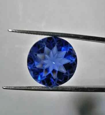 AAA Tanzanite Round 13x13x9.00 MM Fantasy Cut Modern Flower Cut loose Gemstone - Image 1 of 4