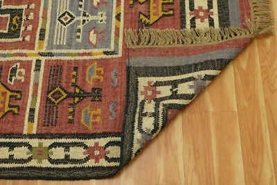 Alfombra de área Klim geométrica de lana tejida a mano tejido plano alfombra de sala de estar 6x9 pies Foto 1 de 4