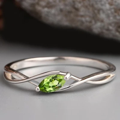 Anillo solitario de piedras preciosas de peridoto natural marquesa de 3,00 quilates chapado en platino 950PT Foto 1 de 4