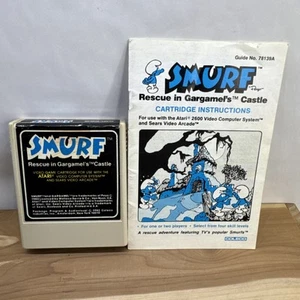 Schlumpf: Rettung in Gargamels Schloss (Atari 2600, 1982) Spielkassette und Handbuch - Bild 1 von 8