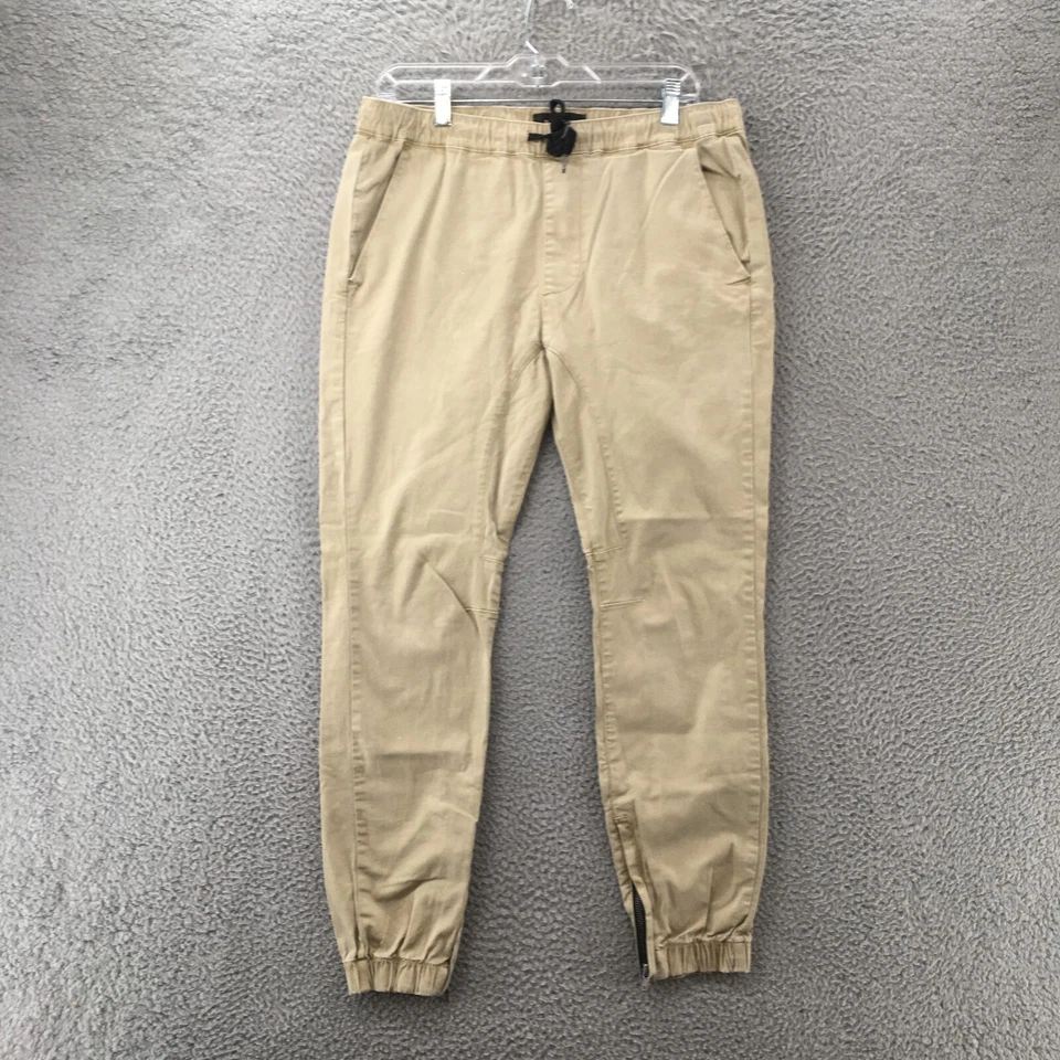 Pantalones de chándal Pacsun para hombre medianos beige cintura elástica ajuste ajustado cremallera tobillo Foto 1 de 4