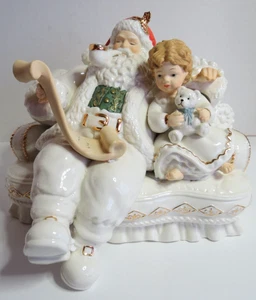 Papá Noel de porcelana Heritage Mint 2003 en sofá con niño y lista traviesa/bonita - Imagen 1 de 11