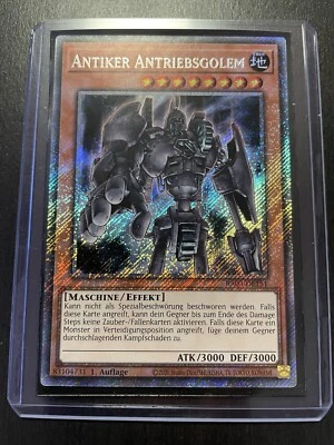Yu-Gi-Oh! Antiker Antriebsgolem RA03 Platinum Secret Rare Near Mint 1. Auflage - Bild 1 von 4