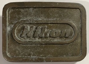 Cámaras fotográficas Nikon de colección LATÓN hebilla de cinturón Amebic INC Lynbrook NY - Imagen 1 de 4