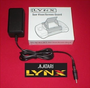 9V AC Adapter Power Supply & Sun Visor Screen Guard for Atari Lynx II System NEW - Picture 1 of 3