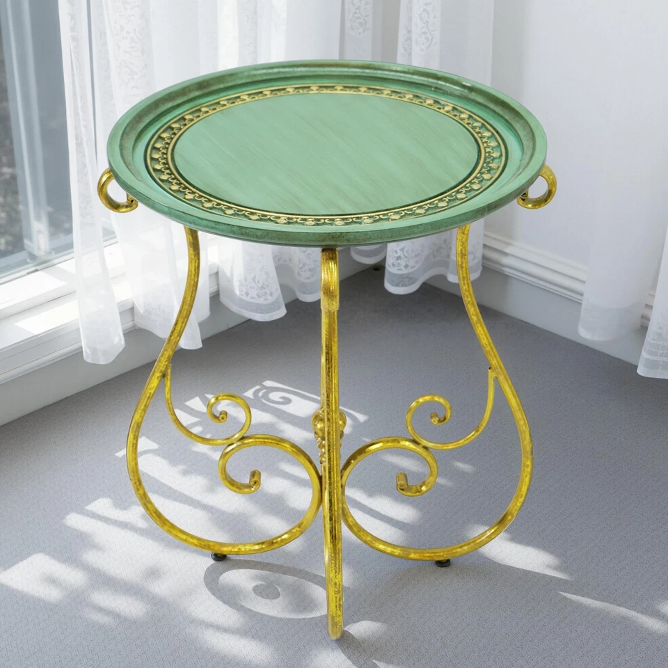 Mesa redonda vintage con tapa verde decorativa y pata de hierro con desplazamiento dorado... Foto 1 de 4