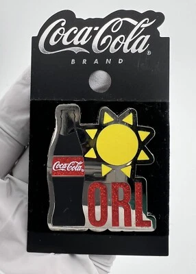 Prendedor esmaltado en tono plateado marca Coca-Cola Orlando Florida Sunshine. Foto 1 de 4