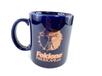 Feldene Piroxicam Coffee Mug Cup Pharmaceutical Ad Promo Vintage L Davinci Art - Image 1 of 4