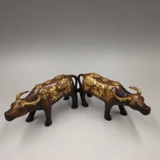 A pair Chinese Old Brass red gold-plated sculpture Make money Cow statue