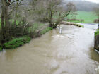 Photo 6x4 The Ford at Strefford A swollen Quinny Brook as it flows across c2018