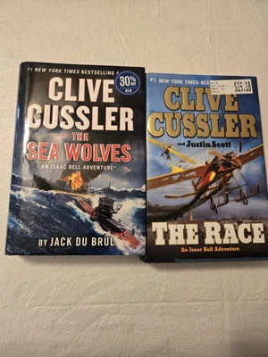 Clive Cussler The Sea Wolves & The Race An Isaac Bell Adventure Series Novels - Image 1 of 2