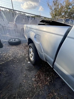 Nissan Frontier 2001 2002 2003 2004 cuarto trasero derecho acabado acampanado OEM Foto 1 de 4