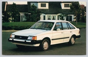 1986 Ford Escort 4-Door Dealer Advertising Postcard - Picture 1 of 2