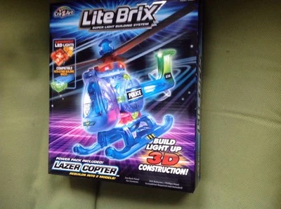 Lite Brix Lazer Copter Policía Helicóptero Luces LED Nuevo sellado en caja Foto 1 de 4