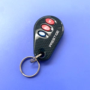 NEW PRESTIGE 3-BUTTON REMOTE TRANSMITTER FOB APS99BT3BCF4 ELVAT1C w/ PROGRAMMING - Picture 1 of 2