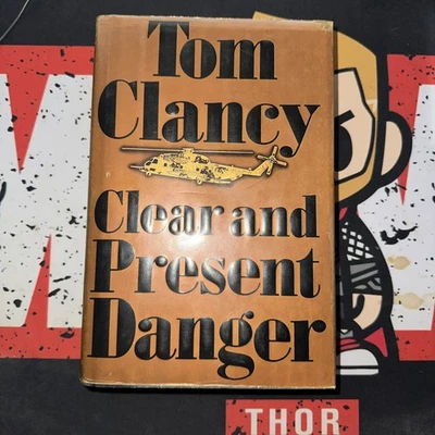 Tom Clancy *CLEAR AND PRESENT DANGER* HC/DJ 1st Edition - 1st Printing - Image 1 of 4