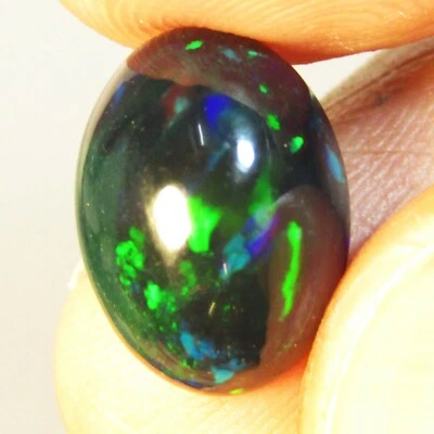 3.37Cts Natural Multi Color Play Black Opal 13.7x10x5.8mm Oval Cabochon Gemstone - Image 1 of 4