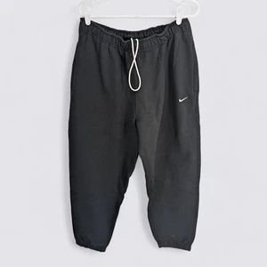 Nike Solo Swoosh Men's Fleece Loose Fit Joggers Pants Size Large - Picture 1 of 3