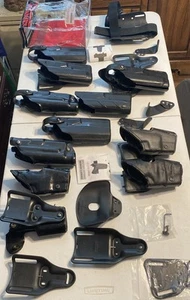 Large Lot Of As-is Safariland duty Holsters Level 2 & 3 - Picture 1 of 24