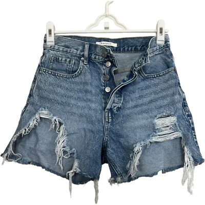 Pantalones cortos de mezclilla de tiro alto Festival talla 26 desgastados con botones mosca Foto 1 de 4