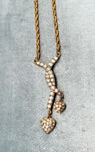 Swarovski Gold Tone 16” Necklace with   2 pave hearts crossing at the bottom - Picture 1 of 7