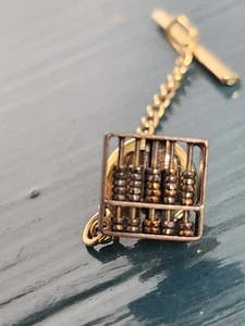 Abakus Tie Tac goldfarbene bewegliche Perlen - Bild 1 von 3