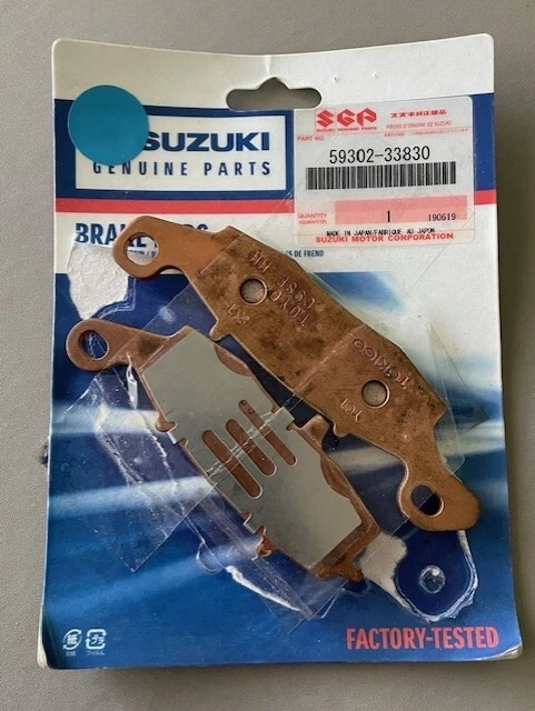 SUZUKI NOS L/H BRAKE PAD AND SHIM SET '99-'12 SV650/S/SA/SU OEM 59302-33830 - image 1 of 1